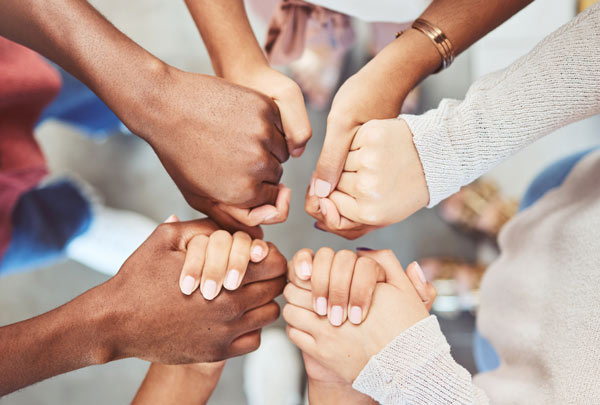 A group of people holding hands